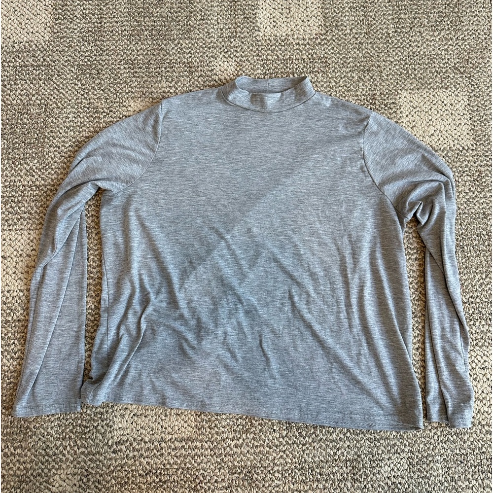 Thin women’s grey turtleneck long sleeve shirt